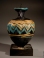 Greek core-formed blue glass amphoriskos with turquoise and yellow glass trailing.