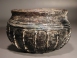 Early Roman purple glass ribbed bowl with white marvered trail