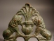 Bronze plaque with relief of two heraldic lions and amphora