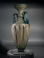 Roman bluish-green glass amphoriskos with molded body and twin deep turquoise glass handles.