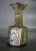 Early Christian light olive green hexagonal glass jug with three crosses.
