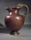 Roman bronze oinochoe with panther handle.