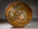 Early Roman golden-amber glass ribbed bowl.