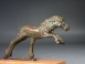 Hellenistic bronze galloping horse.