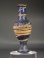 Hellenistic core-formed blue glass spindle-shaped unguentarium.