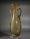 Roman greenish yellow glass amphora with turquoise-green glass twin handles.