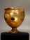 Roman yellowish green glass goblet.