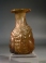 Roman yellowish green glass Janus head flask.