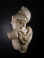 Roman marble of a Greek warrior, a fragmentary sarcophagus relief.