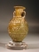 Sidonian mold blown yellow glass flask with tendril scrolls