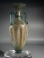 Roman bluish-green glass amphoriskos with molded body and twin deep turquoise glass handles.