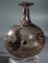 Roman light purple glass bottle with white glass spiral thread and trefoil rim.