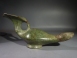 Byzantine bronze lamp with a cross and blossom handle.