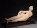 Parthian alabaster reclining figurine of a woman, possibly Aphrodite.