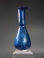 Early Roman cobalt blue glass unguentarium (cosmetic flask).