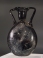 Late Roman dark amber - black glass lentoid flask.