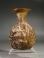Roman yellowish green glass Janus head flask.