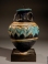 Greek core-formed blue glass amphoriskos with turquoise and yellow glass trailing.