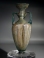 Roman bluish-green glass amphoriskos with molded body and twin deep turquoise glass handles.