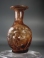Roman light purple glass putto Janus head flask.