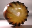 Early Roman amber glass ribbed bowl.