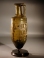 Roman olive green glass amphora with wheel-cut ornament and pointed-base.