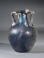 Roman blue glass amphoriskos.