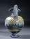 Eastern Mediterranean blue core form glass oinochoe with yellow and turquoise ornament.