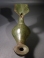 Byzantine bronze lamp with a cross and blossom handle.