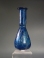 Early Roman cobalt blue glass unguentarium (cosmetic flask).