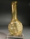 Roman golden yellow glass Janiform head flask