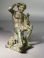 Hellenistic bronze Satyr seated on a rock