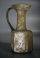 Early Christian light olive green hexagonal glass jug with three crosses.
