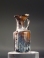 Roman amber glass juglet with trefoil mouth and ribbed body.