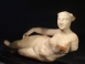 Parthian alabaster reclining figurine of a woman, possibly Aphrodite.