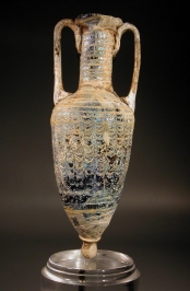 Hellenistic deep purple core formed glass amphoriskos.