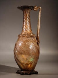 Roman light purple-pinkish glass jug with wide ridged handle