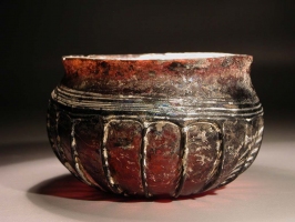 Early Roman purple glass ribbed bowl with white marvered trail