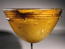 Hellenistic amber golden-yellow glass molded conical bowl.