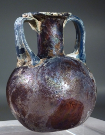 Roman purple glass aryballos with marbled blue glass handles