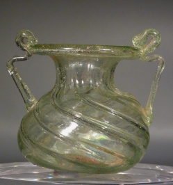 Roman clear glass jar with two handles.