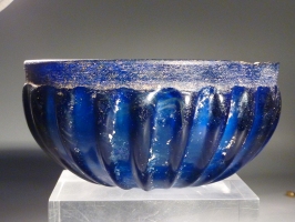 Early Roman blue glass ribbed bowl.
