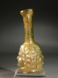 Roman golden yellow glass Janiform head flask