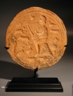 Early Christian terracotta stamp depicting Christ or King David as Orpheus, playing the harp before the animals