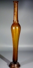 Roman golden yellow glass tall unguentarium.